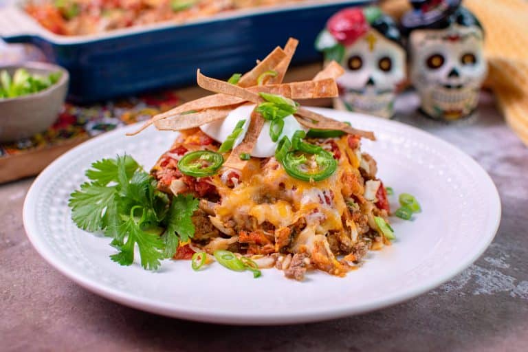 Baja Taco Bake topped with cut da carb tortilla strips and sour cream