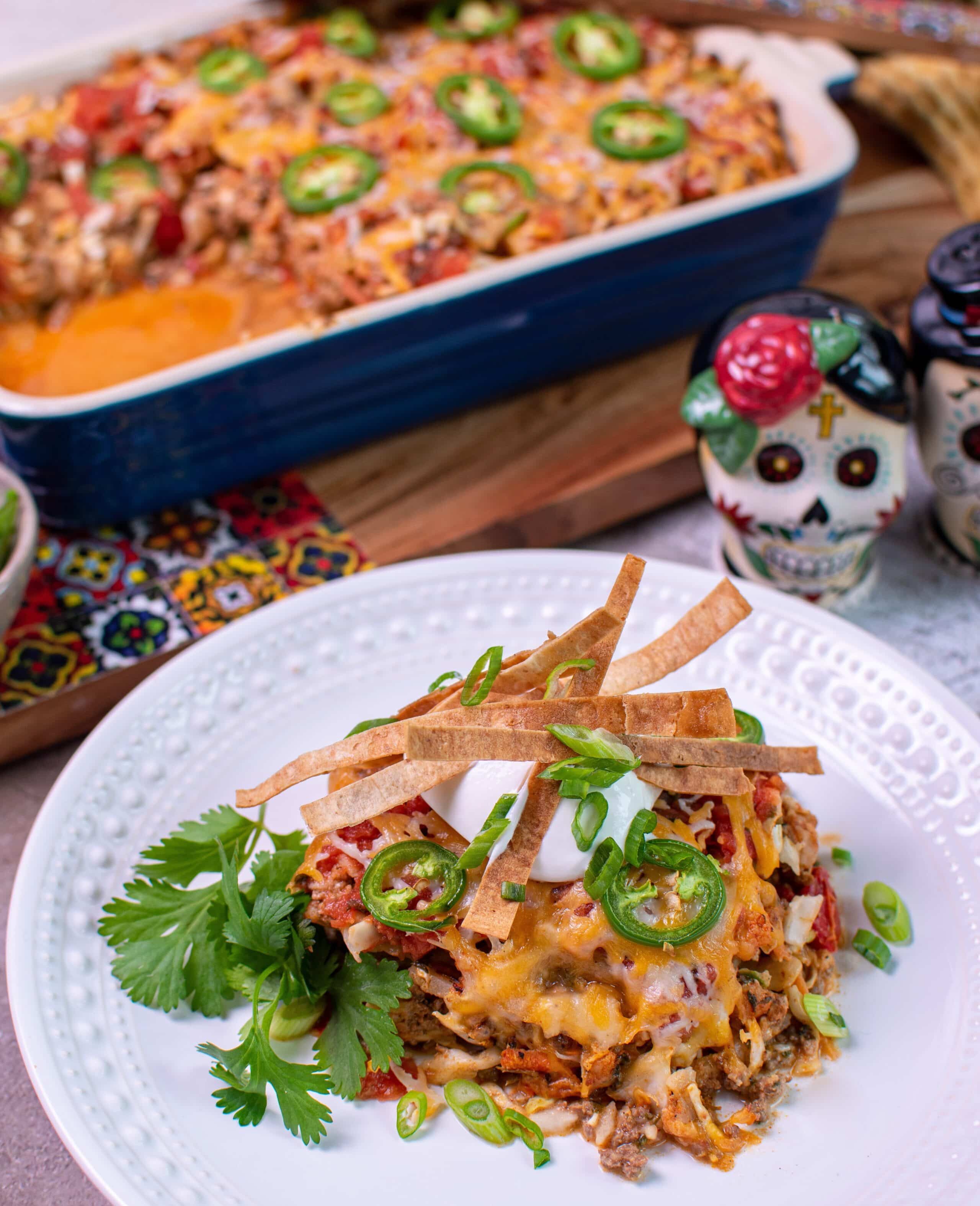 Baja Taco Bake topped with cut da carb tortilla strips and sour cream