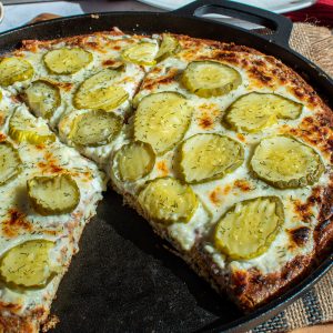 low carb dill pickle pizza served on a cast iron pan