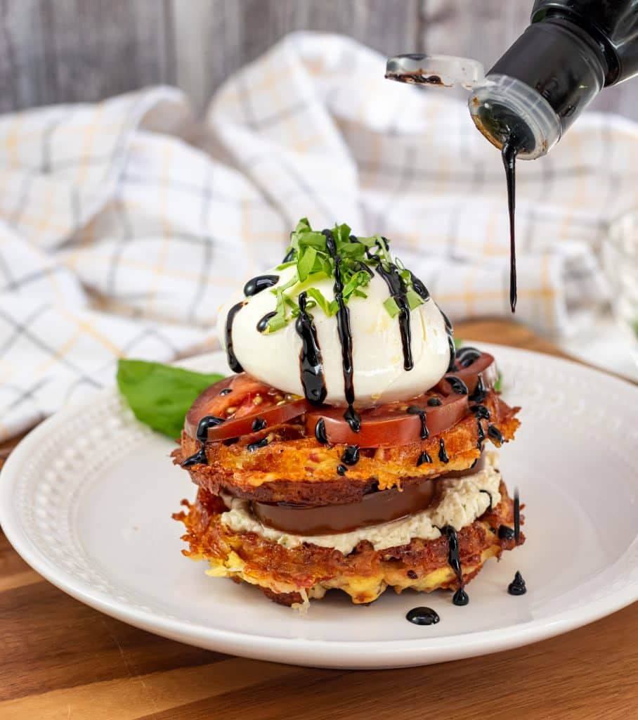 Drizzling balsamic reduction on the Buratta Chaffle