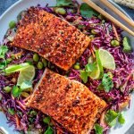 Asian red cabbage slaw with creamy cilantro lime dressing topped with salmon
