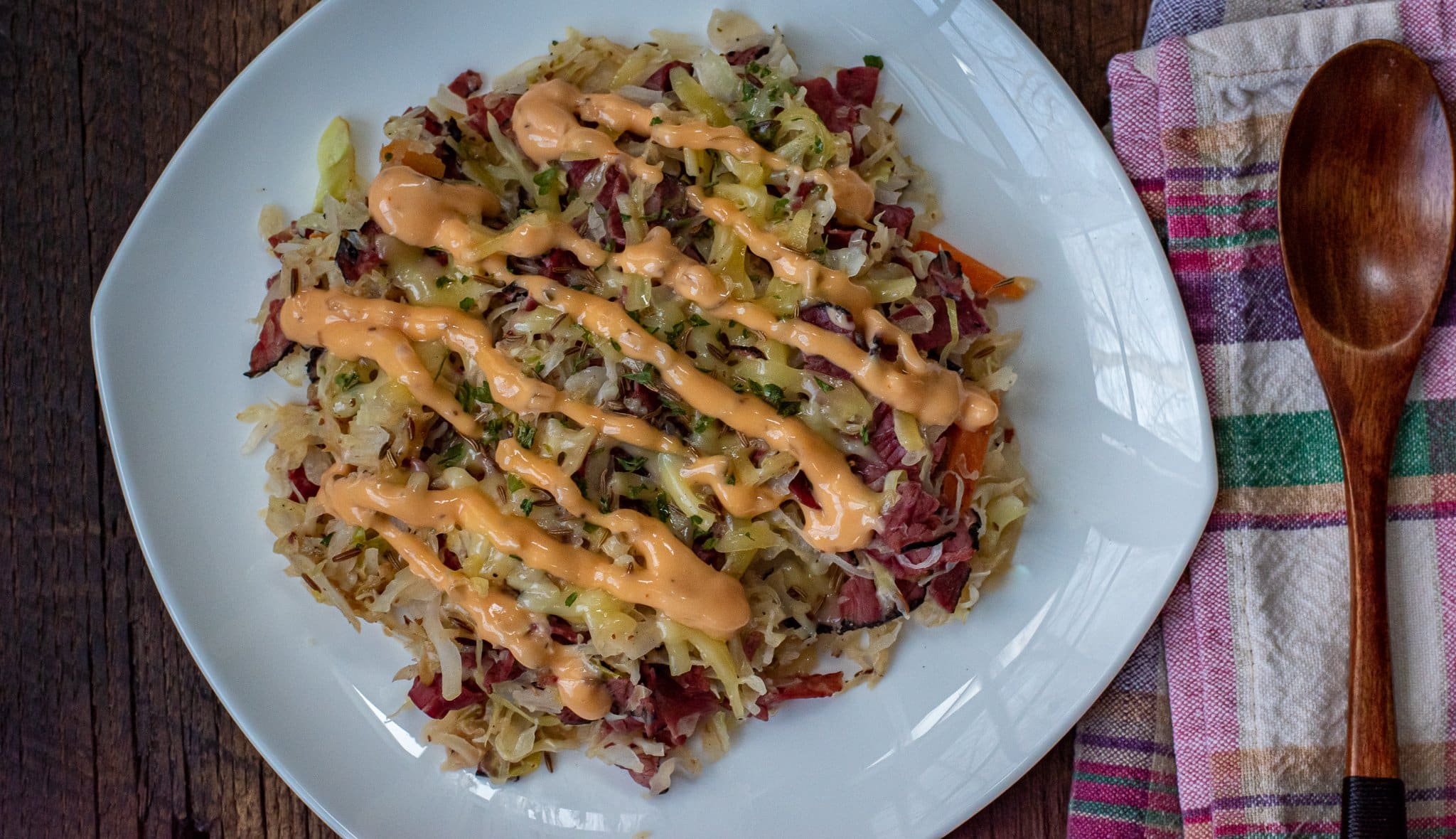 rueben egg roll bowl with a drizzle of Russian dressing on top