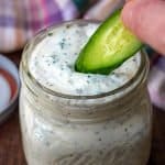Ranch dressing dipping with a cucumber
