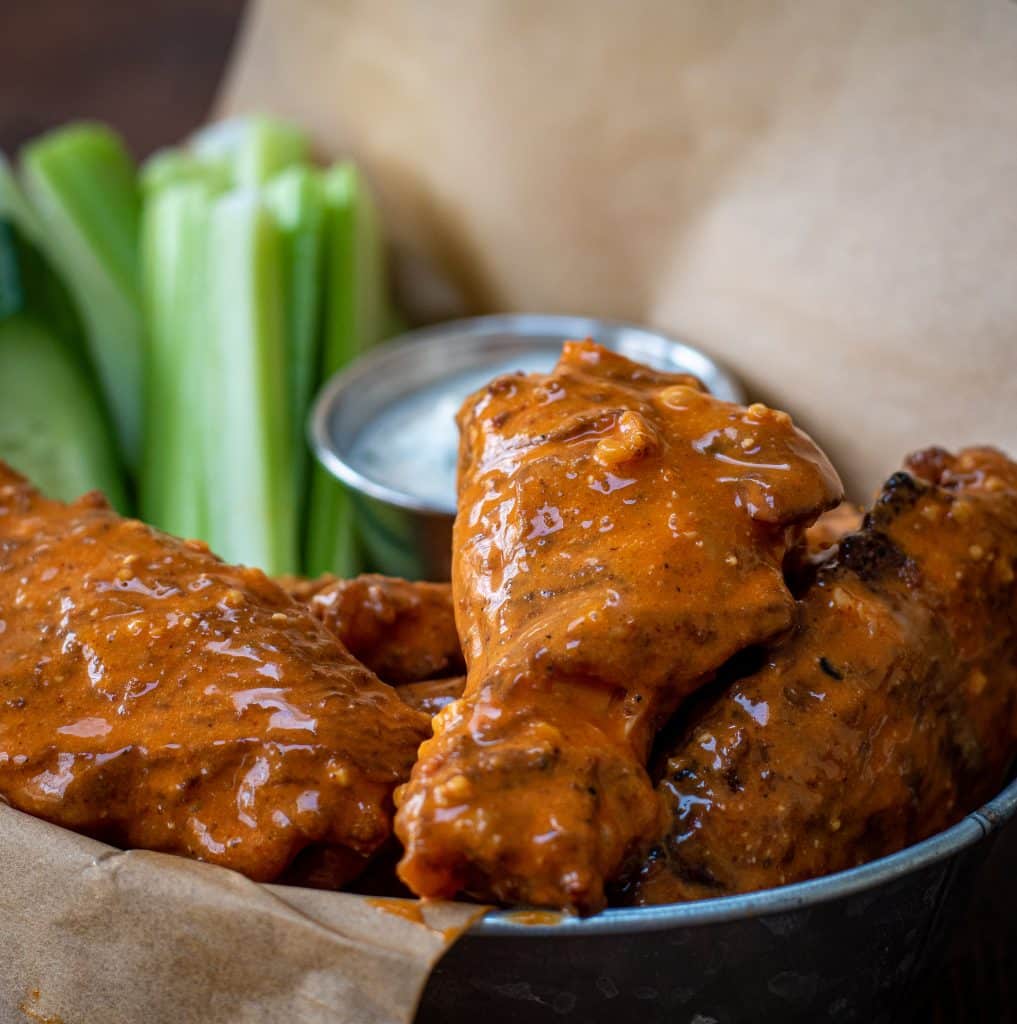 Smoked wings tossed in Chesapeake garlic parm sauce served with carrots, celery, cucumber and ranch dressing