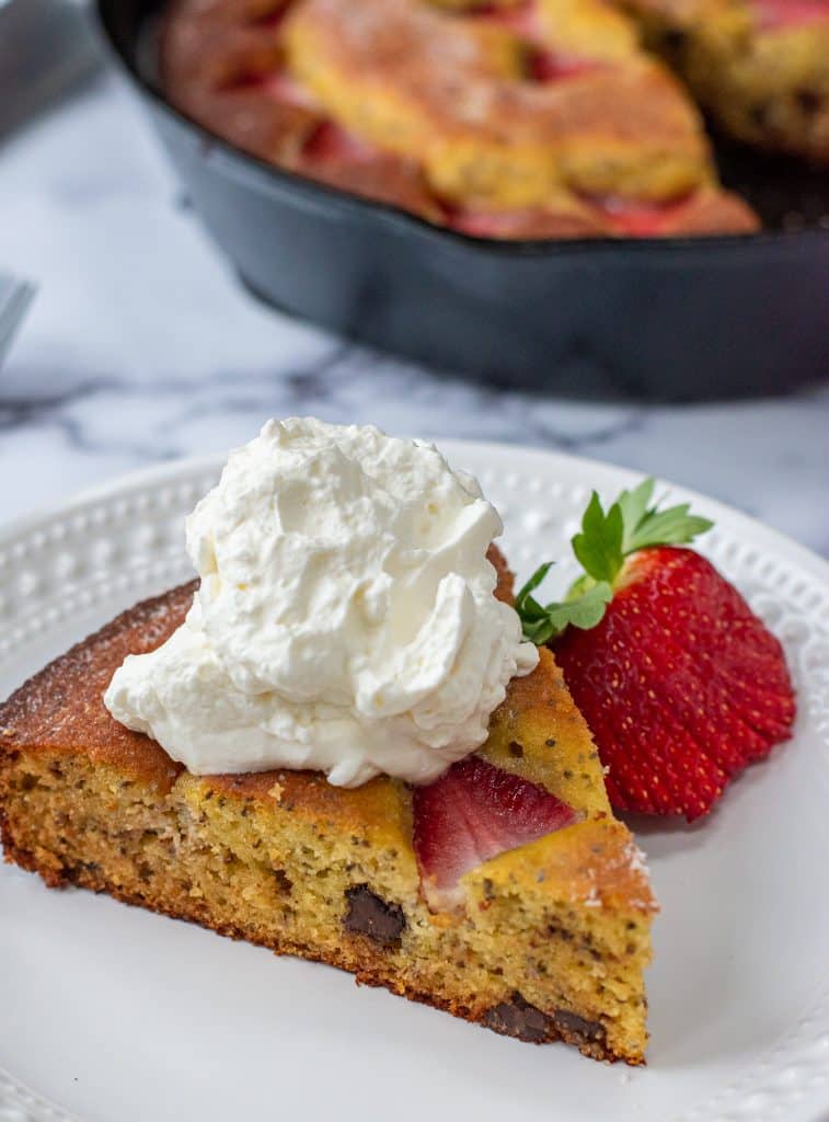 strawberry olive oil cake topped with homemade whipped cream gluten free dessert