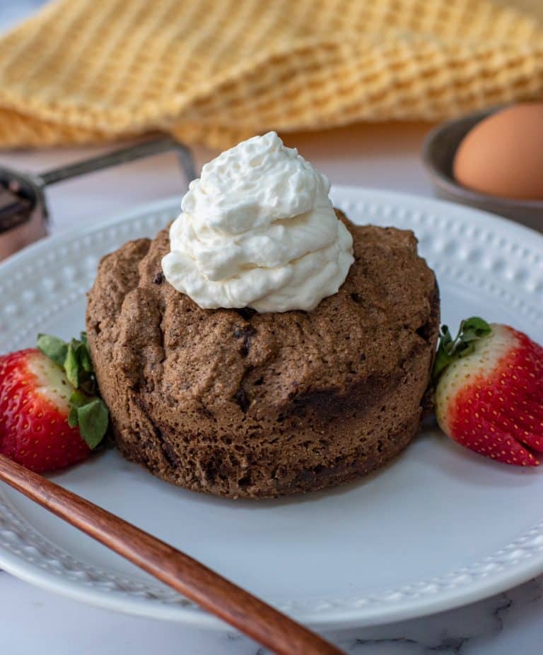 mocha latte colleagen peptide mug cake topped with keto whipped cream