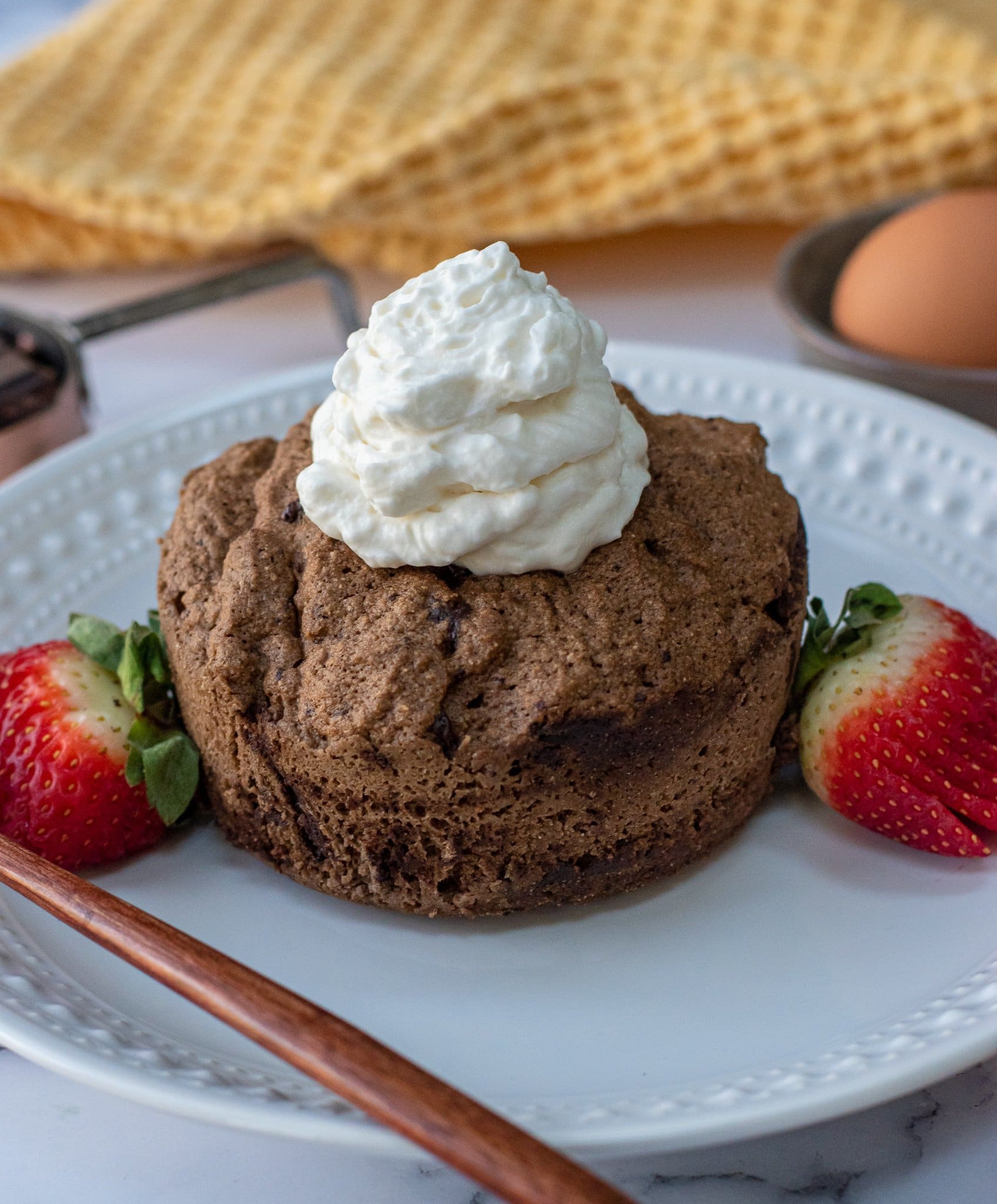 mocha latte colleagen peptide mug cake topped with keto whipped cream