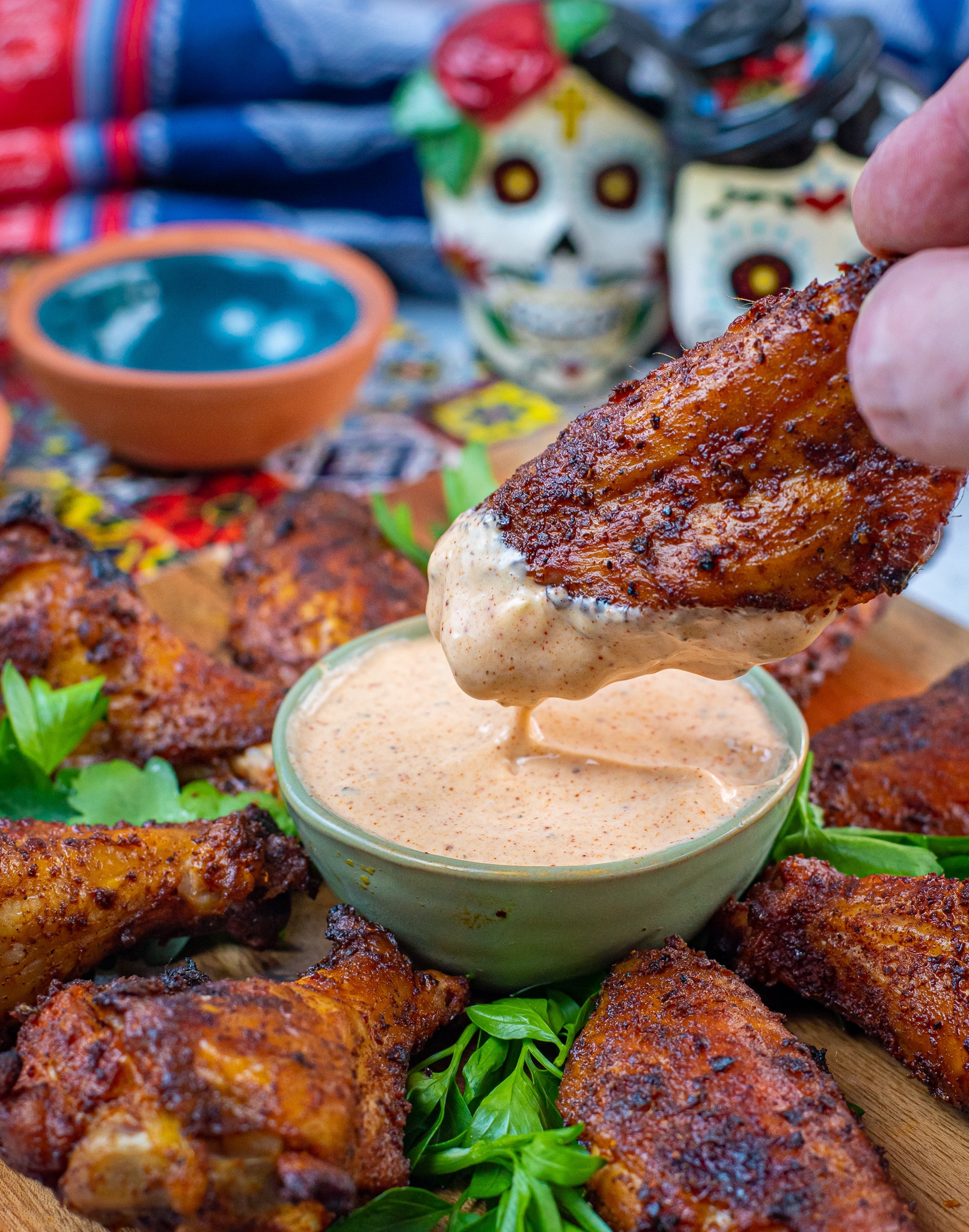 chili rubbed wings dipped in chipotle ranch dressing