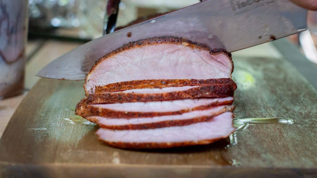 thinly sliced smoked pork loin cut with a sharp knife