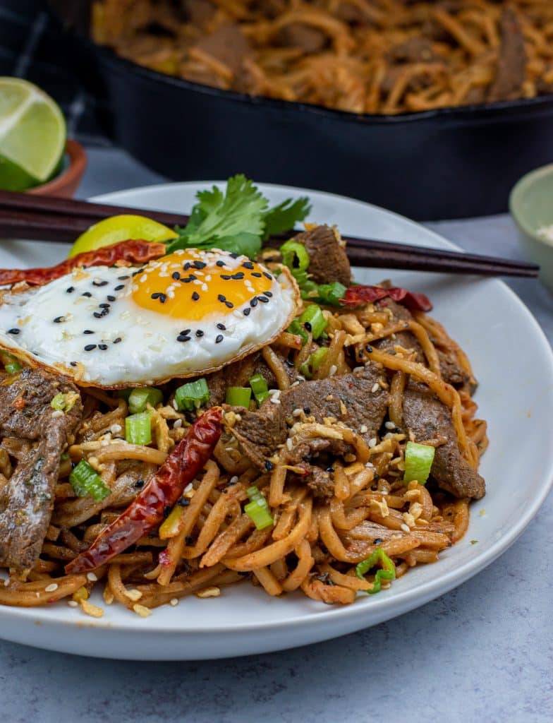 Low carb beef lo mein topped with a fried egg