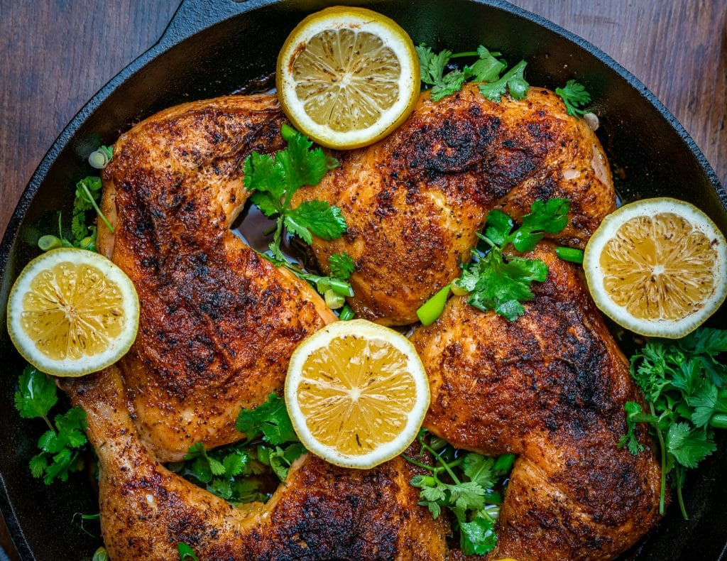 Lemon Pepper Chicken Leg Quarters in the oven Cast Iron skillet