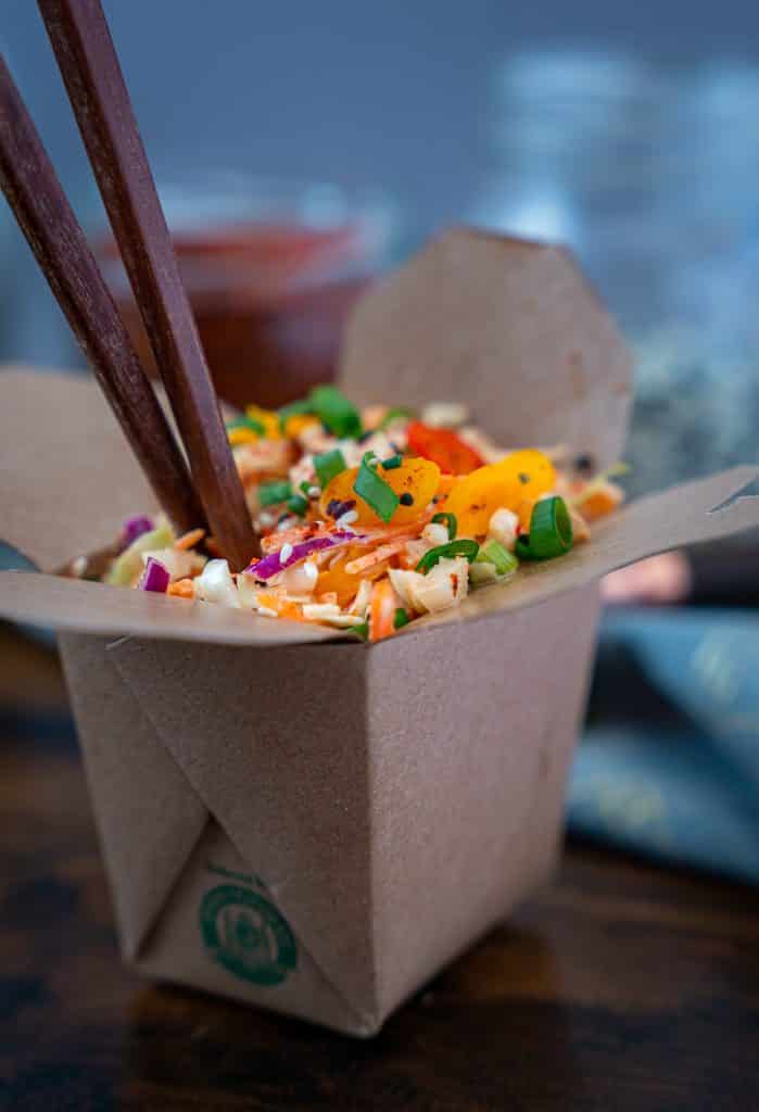 Keto kimchi coleslaw served in a paper carryout container