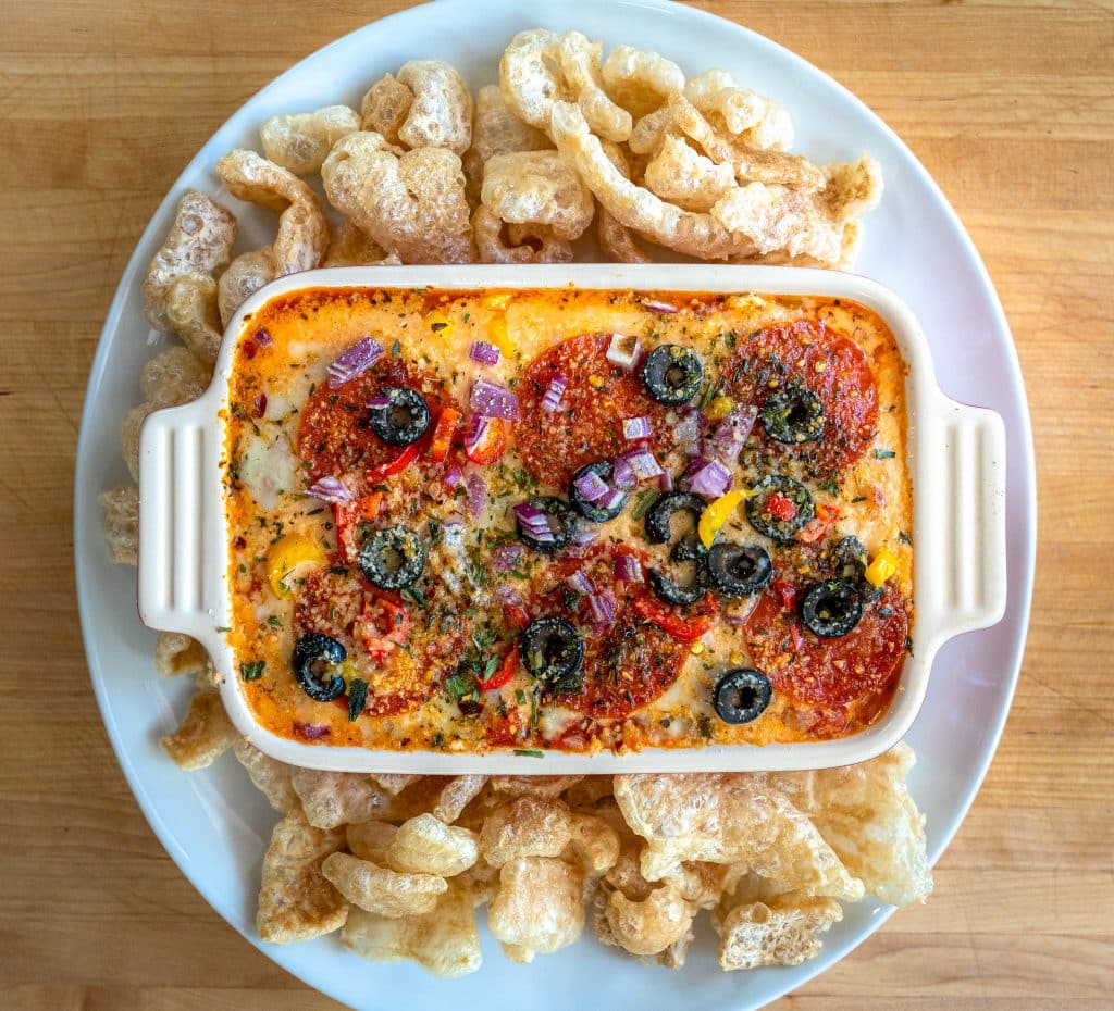 low carb supreme pizza dip served with pork rinds