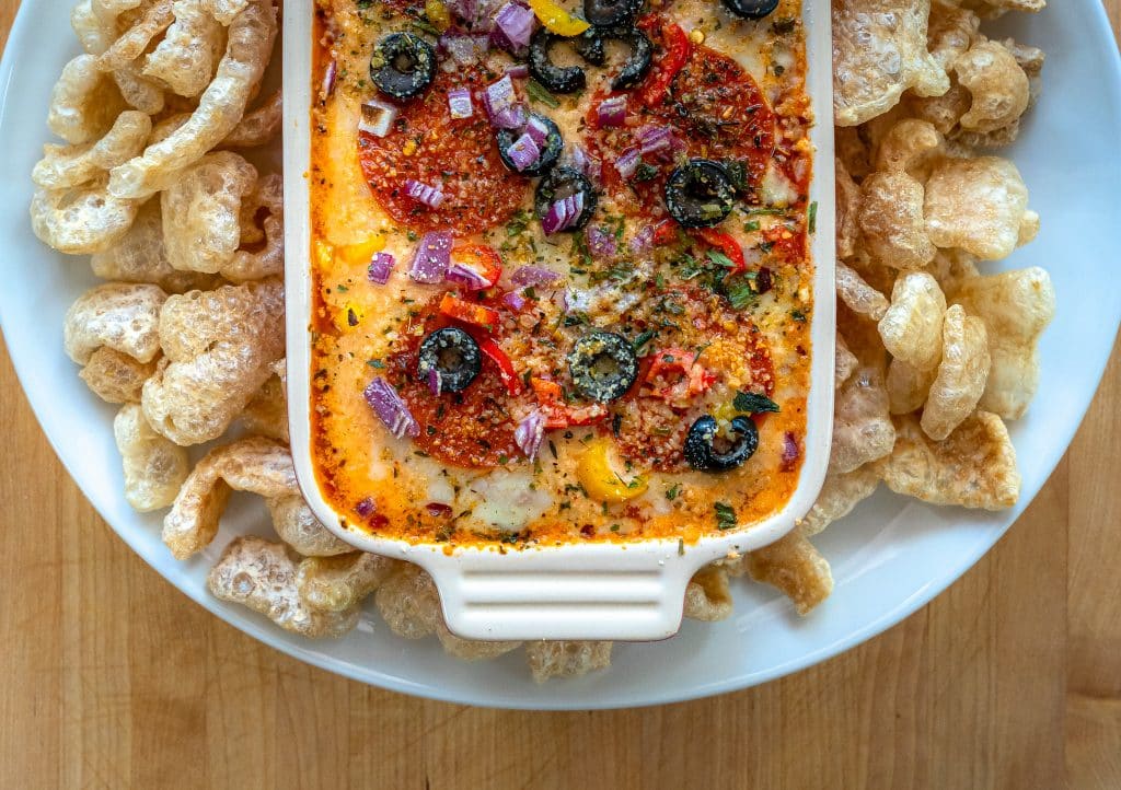 low carb pizza dip served with pork rinds