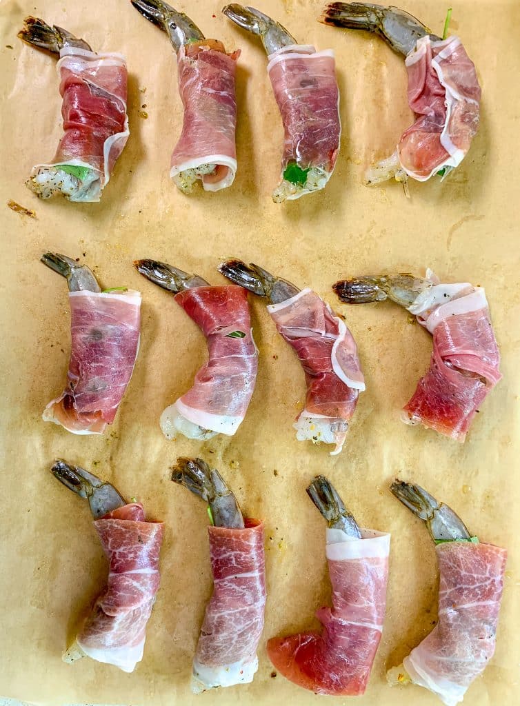 prepped shrimp wrapped with fresh basil and prosciutto