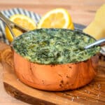 steakhouse style keto creamed spinach with sliced lemons
