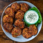 keto broccoli cheese chicken nuggets on a plate with ranch