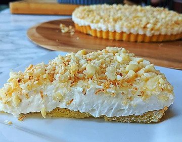 closeup view of toasted coconut cheesecake slice